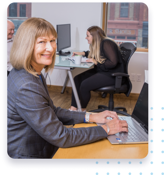 Two women at computer desks