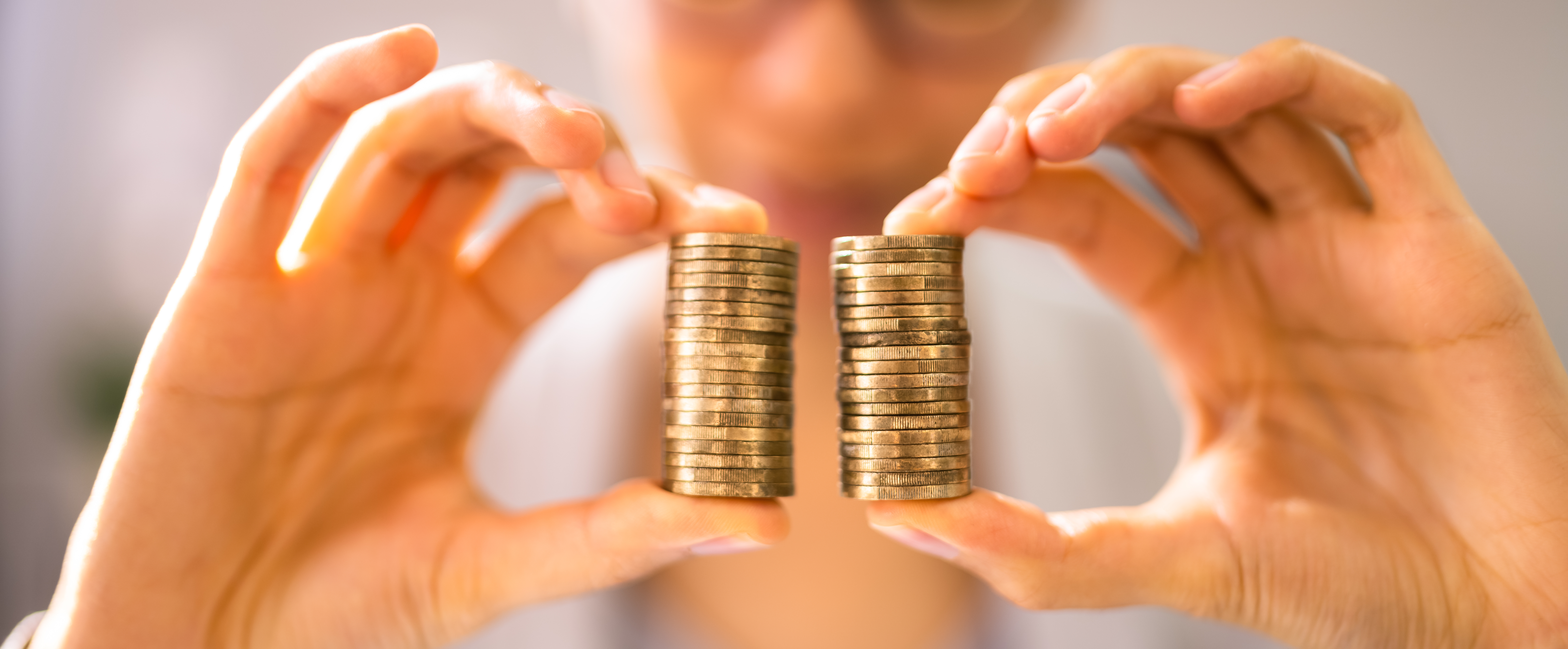 A person holding coins in their hands.